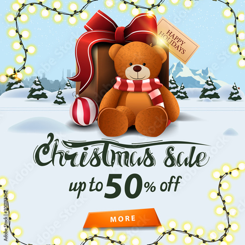 Christmas sale, up to 50% off, square banner with winter landscape, pines, drifts, mountain, city on horizont and big present with Teddy bear