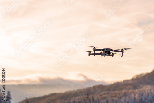 drone flying at dusk.