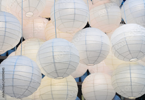 Background of big paper lanterns. Lamps from large paper lanterns as a part of the interior