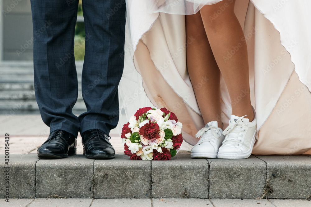 Bride and groom wedding bouquet on the floor. The concept of marriage, family relationships, wedding paraphernalia. Bride and groom wedding bouquet on the floor. The concept of marriage, family relationships, wedding paraphernalia.