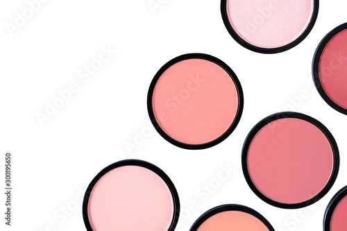 Coral blush and compact powder on white background. Isolated. Beautiful colorful beauty template. Trending shades. Makeup. Cosmetic products. Flat lay