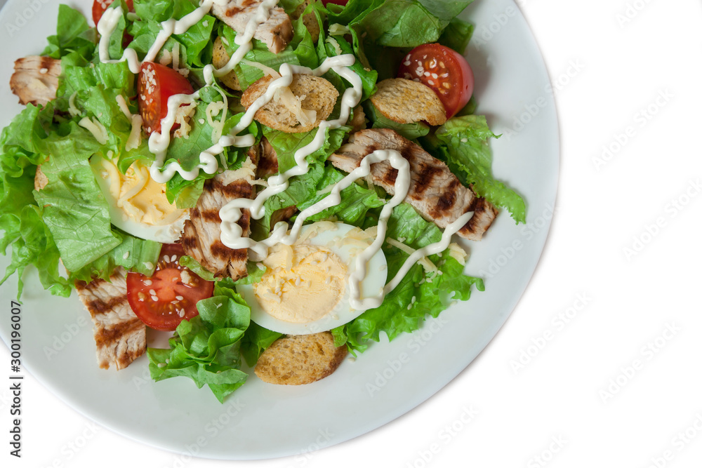 Caesar salad with grill chicken fillet isolated on white background Caesar salad with grill chicken fillet isolated on white background