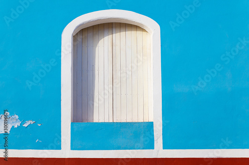 Photography white wooden window in blue facade, trinidad - cuba