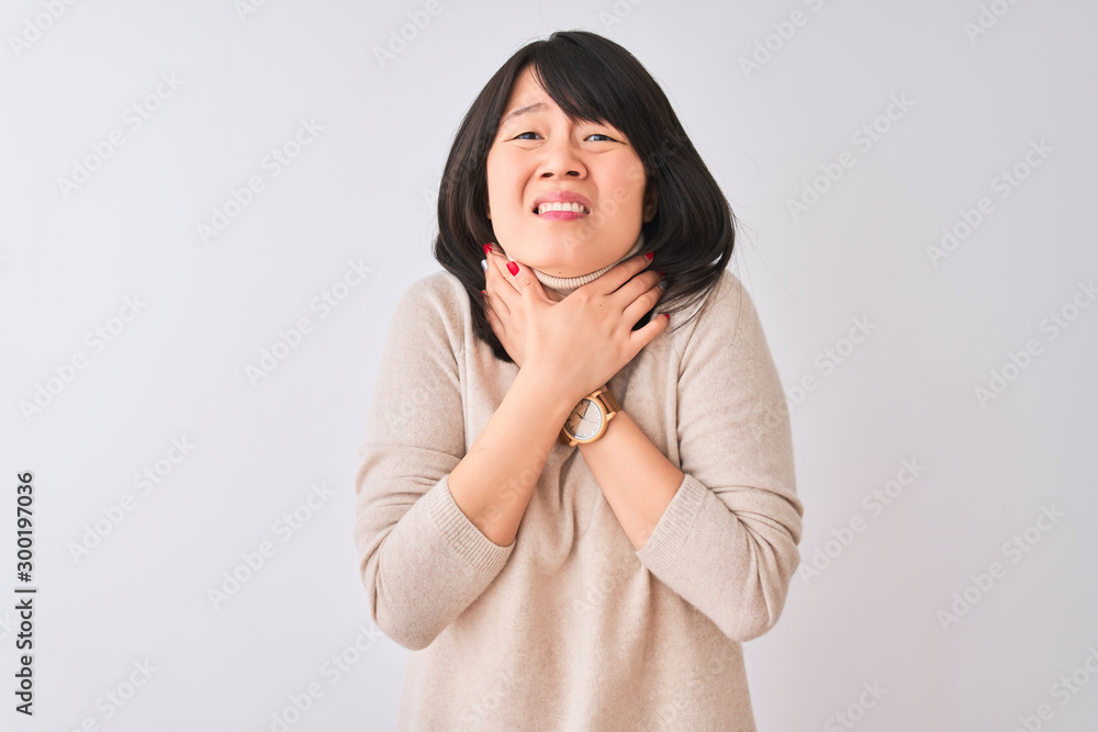 Young beautiful chinese woman wearing turtleneck sweater over isolated white background shouting and suffocate because painful strangle. Health problem. Asphyxiate and suicide concept. Young beautiful chinese woman wearing turtleneck sweater over isolated white background shouting and suffocate because painful strangle. Health problem. Asphyxiate and suicide concept.