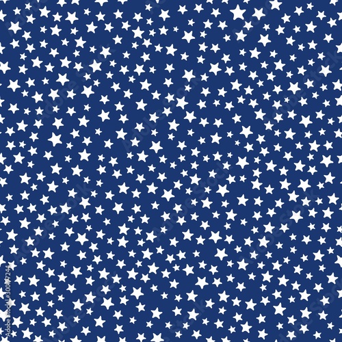 All over seamless repeat pattern with ditsy tiny little white stars on a navy blue night sky background