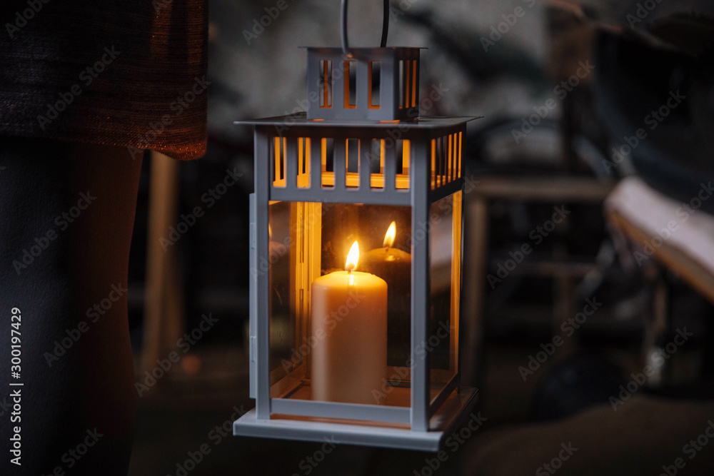 Woman holding lantern with candle in old abandoned house. A lantern  illuminates the way. Creepy scary concept. Halloween night. Ghost town.  Burning candle in scary deep night. Stock Photo | Adobe Stock