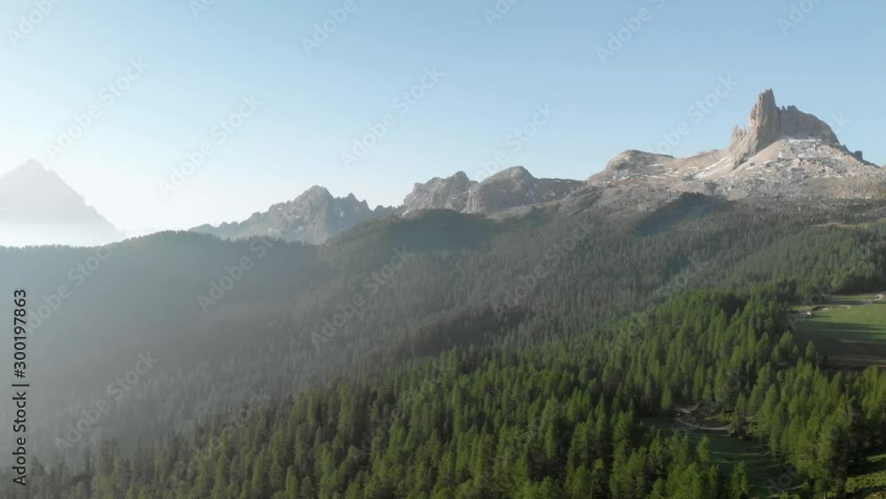Drone aerial flying above mountain pine forest near Croda da Lago Federa in Dolomites Italy at sunrise. Hiking nature epic landscape in South Tyrol. European Alps wanderlust. Drone aerial flying above mountain pine forest near Croda da Lago Federa in Dolomites Italy at sunrise. Hiking nature epic landscape in South Tyrol. European Alps wanderlust.