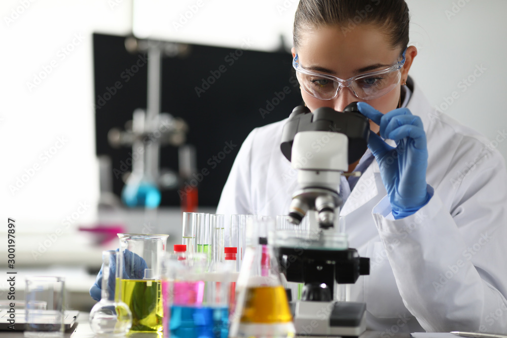 Adult caucasian beauty woman chemist in protective Adult caucasian beauty woman chemist in protective