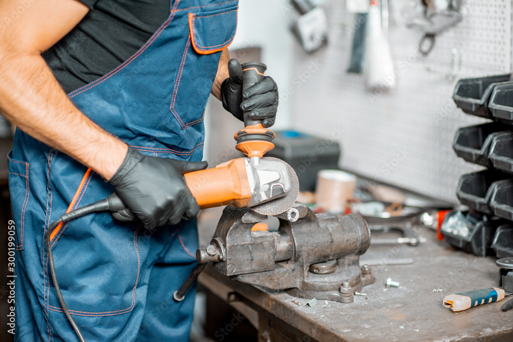 Handyman working with metal at the workshop