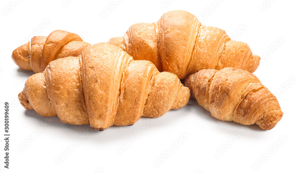 Sweet tasty croissants on white background