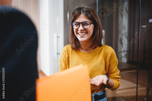 Young happy business lady at modern office have discussing working moments. Group positive people have meeting in open space