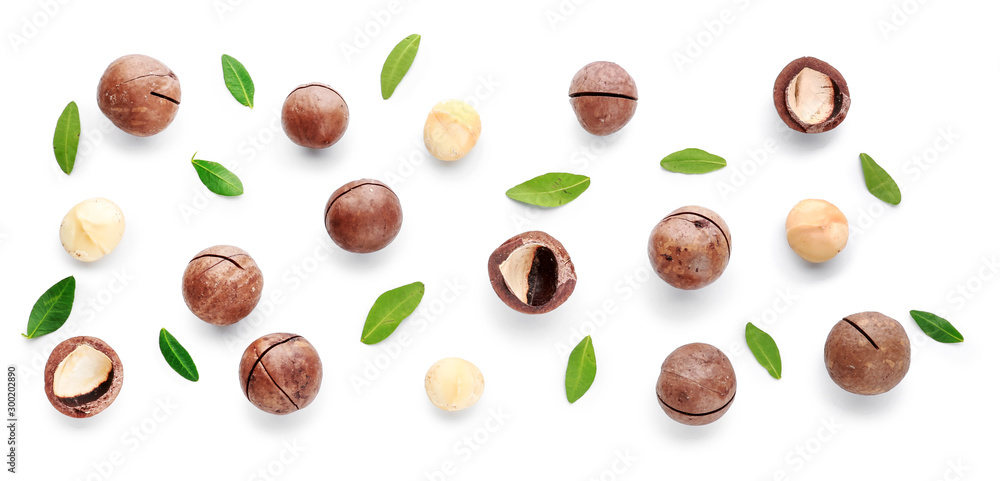 Tasty macadamia nuts on white background - obrazy, fototapety, plakaty 