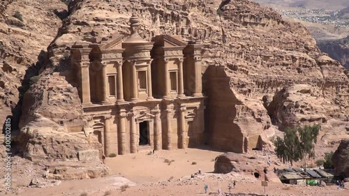 Zoom out view of Ad Deir Monastery in ancient city of Petra, Jordan