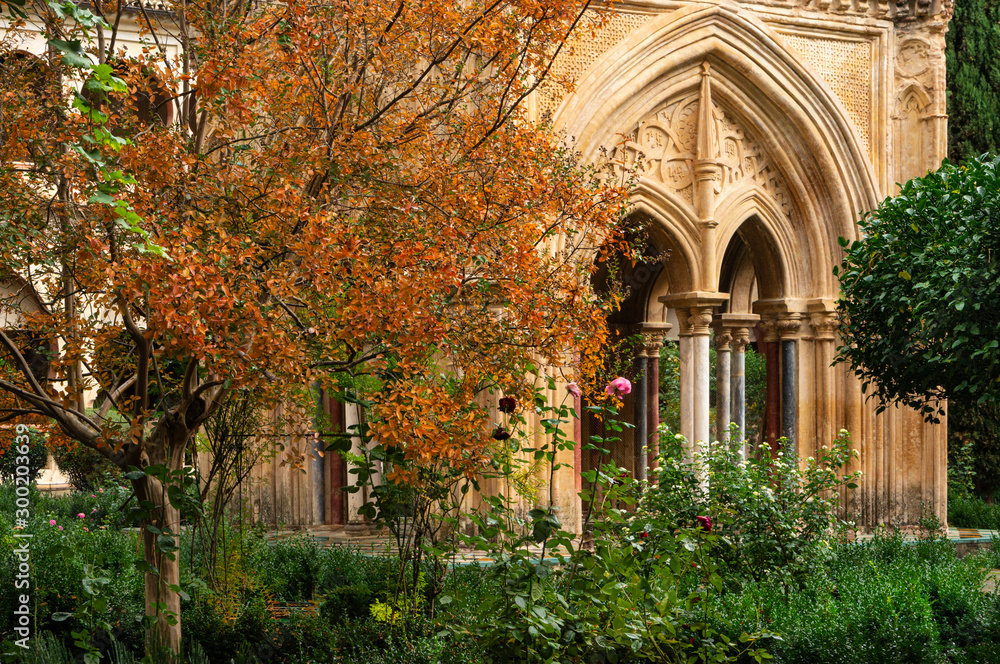 Cloister in autumn of the Mudejar Gothic Monastery of Guadalupe in Spain. World Heritage