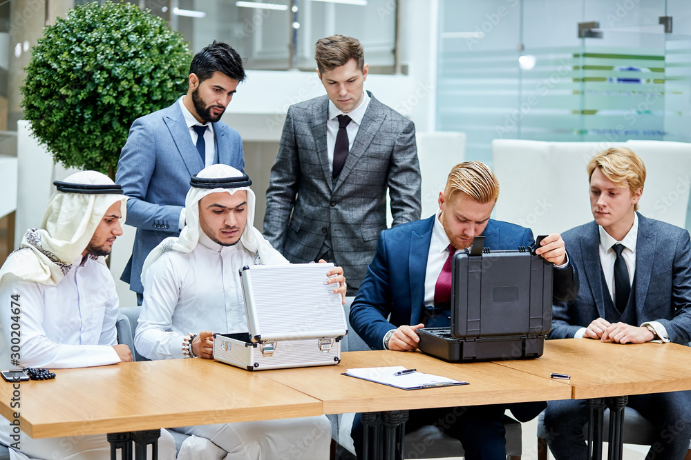 Money and new technologies. Sheikhs going to buy technology for money Money and new technologies. Sheikhs going to buy technology for money