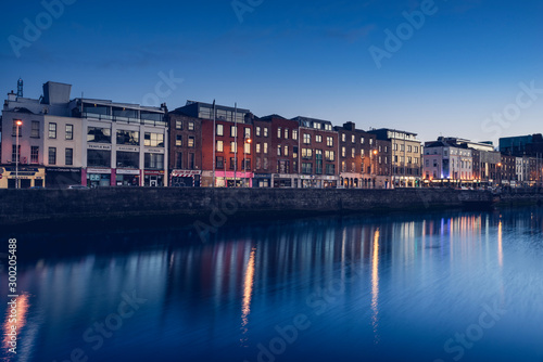 Photography Dublin river with reflection of houses at night sunset