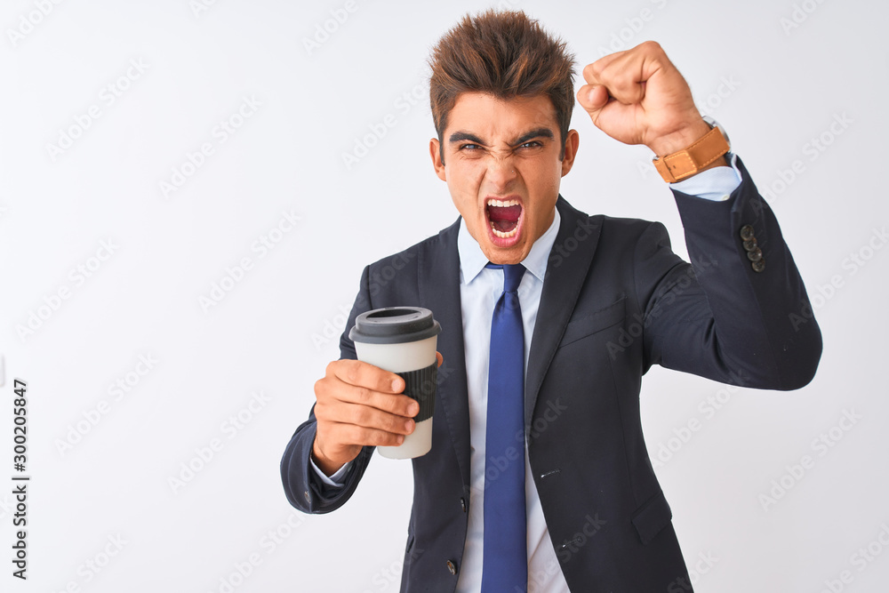 Young handsome businessman wearing suit holding coffee over isolated white background annoyed and frustrated shouting with anger, crazy and yelling with raised hand, anger concept Young handsome businessman wearing suit holding coffee over isolated white background annoyed and frustrated shouting with anger, crazy and yelling with raised hand, anger concept