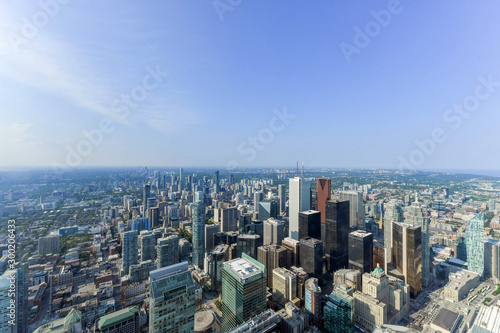 Photography Aerial view of Toronto City Skyscrapers, Looking northeast from top of CN Tower toward East York and Scarborough districts in summer, Union Station at bottom right