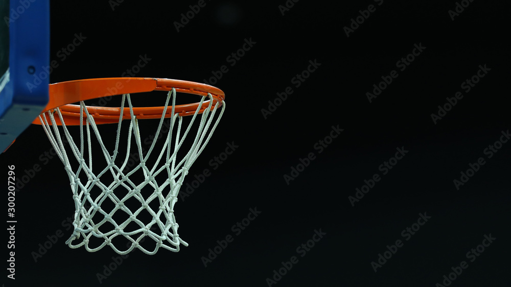 Basketball hoop on a dark background in a sports complex