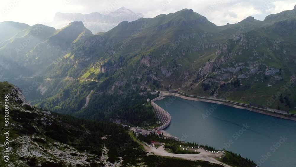 Lago Fedaia (Fedaia lake), an artificial lake and a dam near Canazei, located at the foot of Marmolada massif, as seen from Viel del Pan refuge, Dolomites, Trentino, province of Belluno, Italy Lago Fedaia (Fedaia lake), an artificial lake and a dam near Canazei, located at the foot of Marmolada massif, as seen from Viel del Pan refuge, Dolomites, Trentino, province of Belluno, Italy