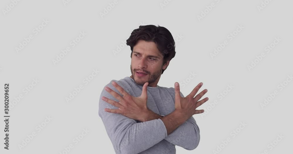 Man having fun while pretending to do magic tricks over white background Man having fun while pretending to do magic tricks over white background