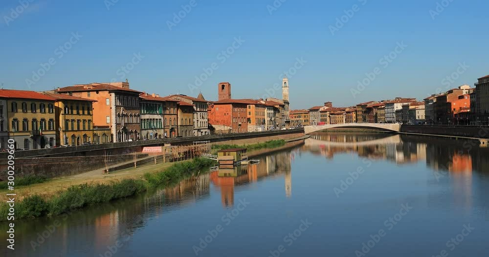 Pisa, Tuscany region, Italy. The bridge Ponte Di Mezzo over the Arno River in autumn. A view of historical center. Amazing reflection of the buildings and the bridge in river Arno Pisa, Tuscany region, Italy. The bridge Ponte Di Mezzo over the Arno River in autumn. A view of historical center. Amazing reflection of the buildings and the bridge in river Arno