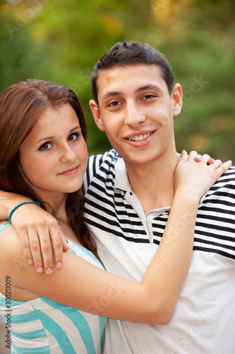 Portrait happy young teenage couple outdoor