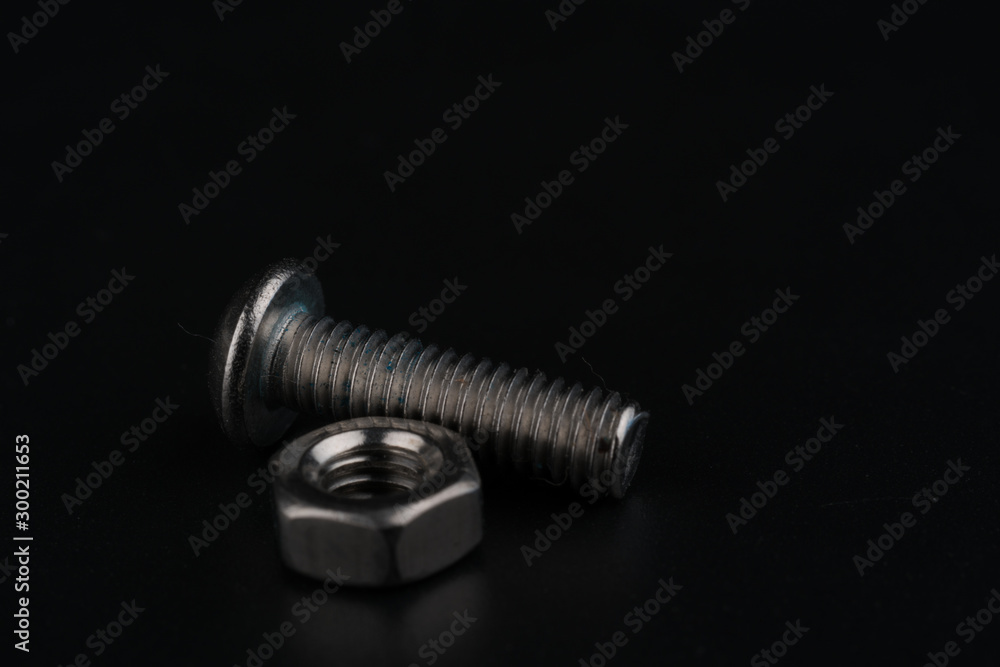 Screw and bolts on black background Screw and bolts on black background