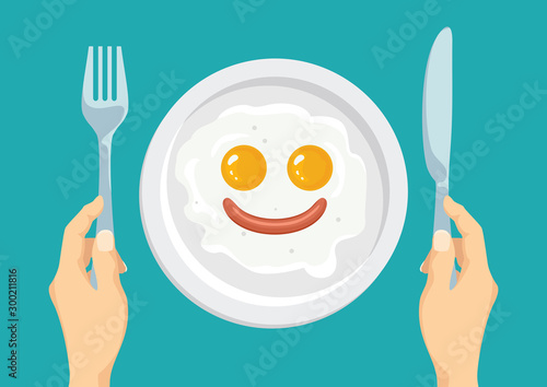 Funny breakfast. Fried eggs and sausage in the shape of smiling face on white plate. Hands hold knife and  fork. Vector food illustration in cartoon simple flat style.