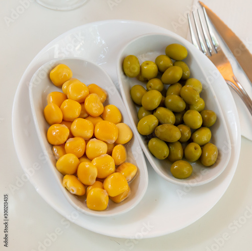 Green unpitted olives and pickled lupin beans