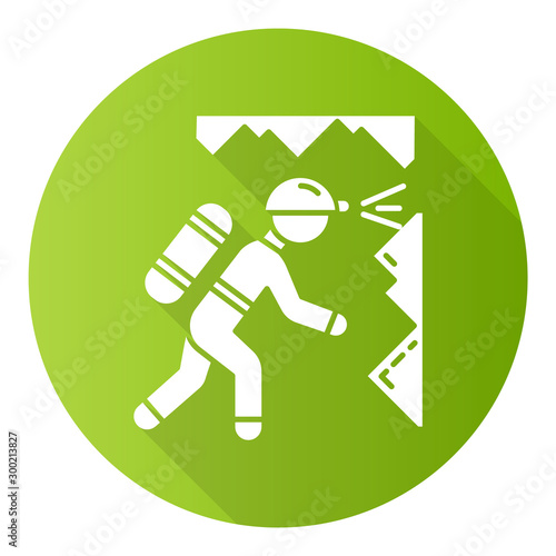 Spelunking green flat design long shadow glyph icon. Caving, potholing. Exploring underground caverns. Equipped spelunker, caver. Walking, climbing in caves. Vector silhouette illustration