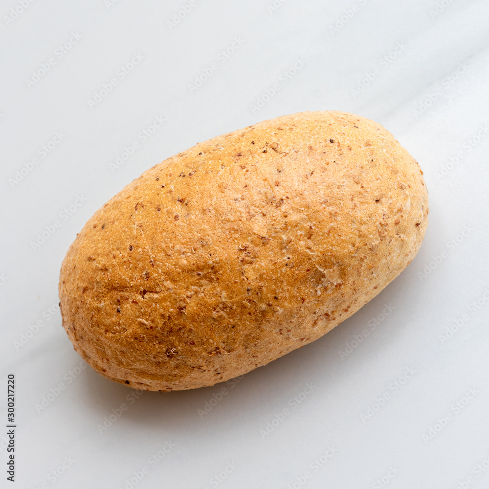 Graham bun on white background. Bakery products, whole wheat bun Graham bun on white background. Bakery products, whole wheat bun