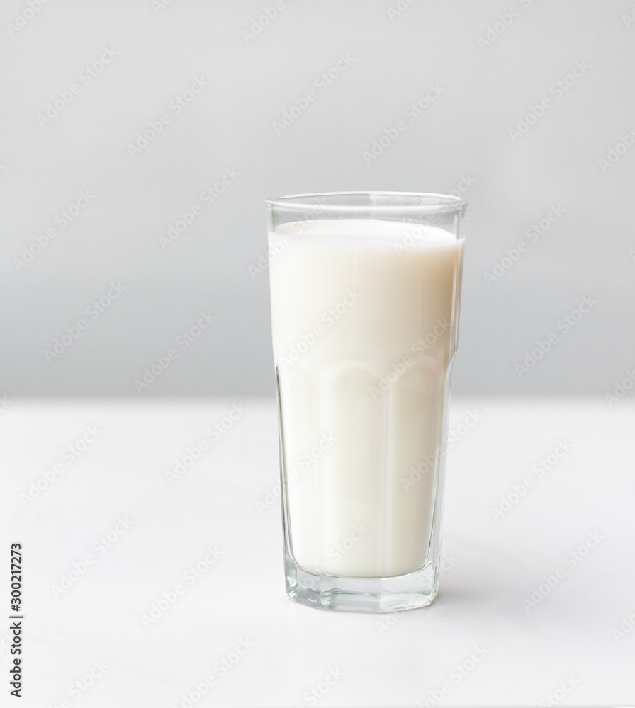 Glass of milk on a white marble table Glass of milk on a white marble table