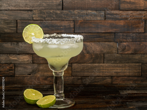 Margarita cocktail drink with lime on ice