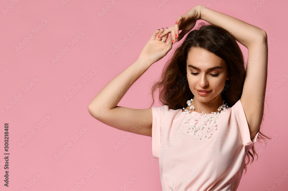 Full length portrait of happy beautiful woman in pink blouse posing in studio isolated on white background Full length portrait of happy beautiful woman in pink blouse posing in studio isolated on white background
