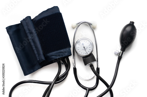 Blood pressure monitor and stethoscope. Medical sphygmomanometer for blood pressure control on white background photo