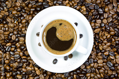 Cup of coffee and roasted coffee beans