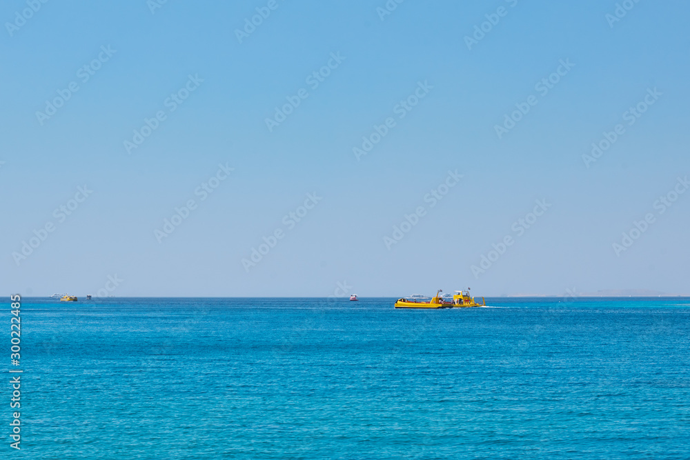 Seascape with ships against blue sky without clouds