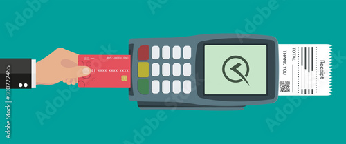 Flat design of POS terminal usage concept. Hand pushing credit or debit card into the pos machine slot. Payment by card concept. Vector illustration.  photo