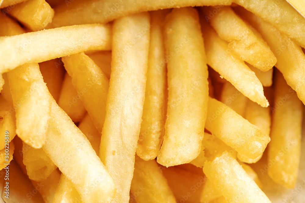 a pile of potato fries close up. background backdrop macro photo. a pile of potato fries close up. background backdrop macro photo.