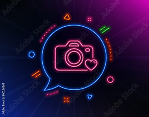 Photo camera line icon. Neon laser lights. Love photography sign. Heart symbol. Glow laser speech bubble. Neon lights chat bubble. Banner badge with photo camera icon. Vector