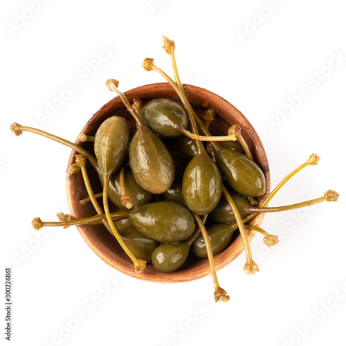 Bowl with capers in vinegar for healthy eating on a white background