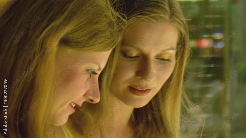 Two Girls Looking At Showcase With Jewelry Two Girls Looking At Showcase With Jewelry