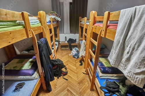 Backpacker dormitory room with some mess photo
