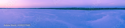 Wide aerial panoramic landscape of pink salt lake at dusk in Australia