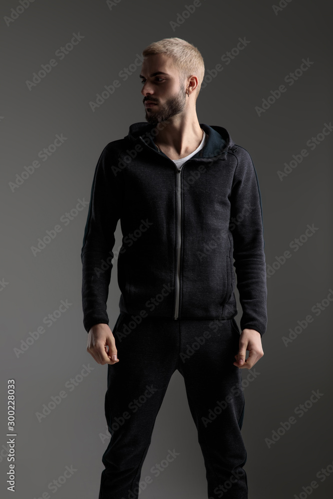 casual man with hands loose looking aside serious casual man with hands loose looking aside serious
