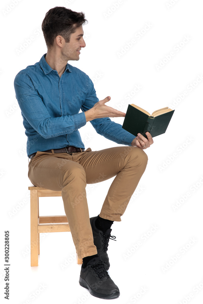 young fashion model smiling and recommending book young fashion model smiling and recommending book