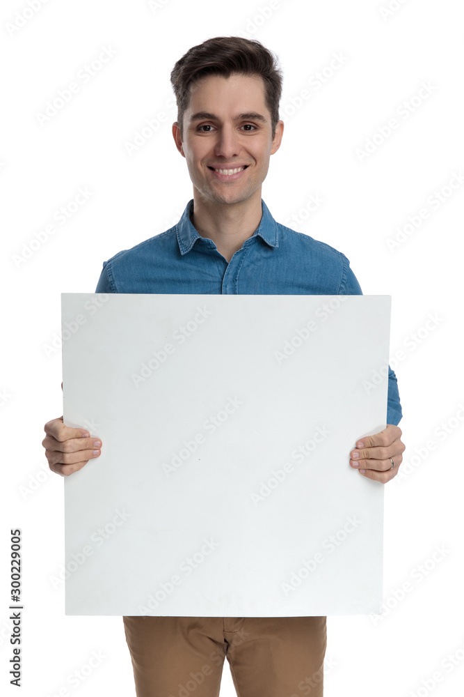 happy smart casual man holding empty board and smiling happy smart casual man holding empty board and smiling