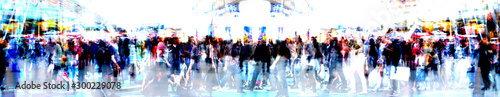Walking people blur. Lots of people walking in the City of London. Wide panoramic view of people crossing the road, multiple exposure image. 