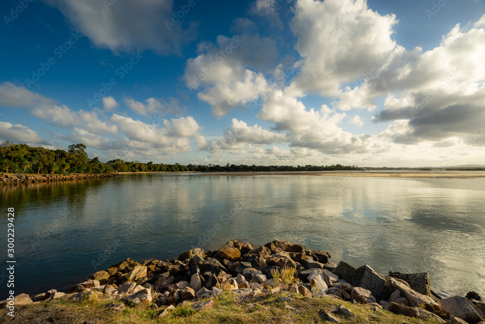 Noosa Heads Australia river mouth sunrise with blue sky and clouds